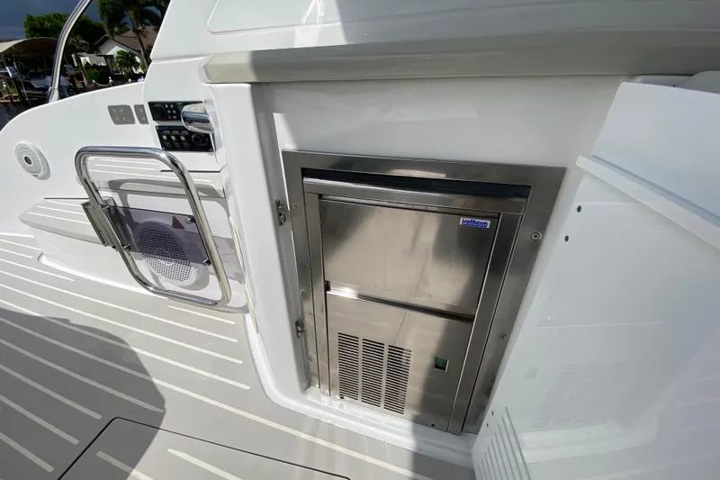  Yacht Photos Pics Azimut Atlantis 45 yacht interior, featuring a built-in stainless steel refrigerator, 2021 model.