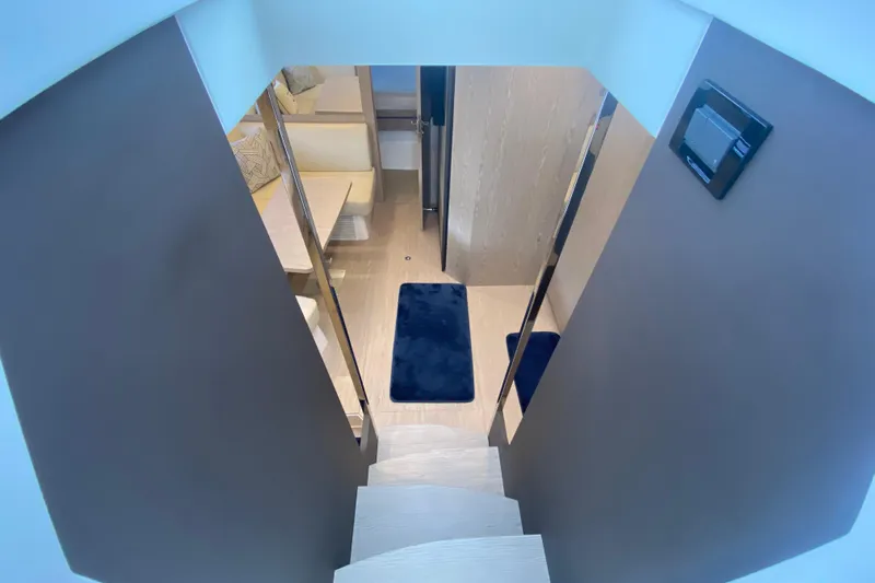  Yacht Photos Pics Interior view of 2021 Azimut Atlantis 45 yacht, featuring modern staircase and cozy seating area.