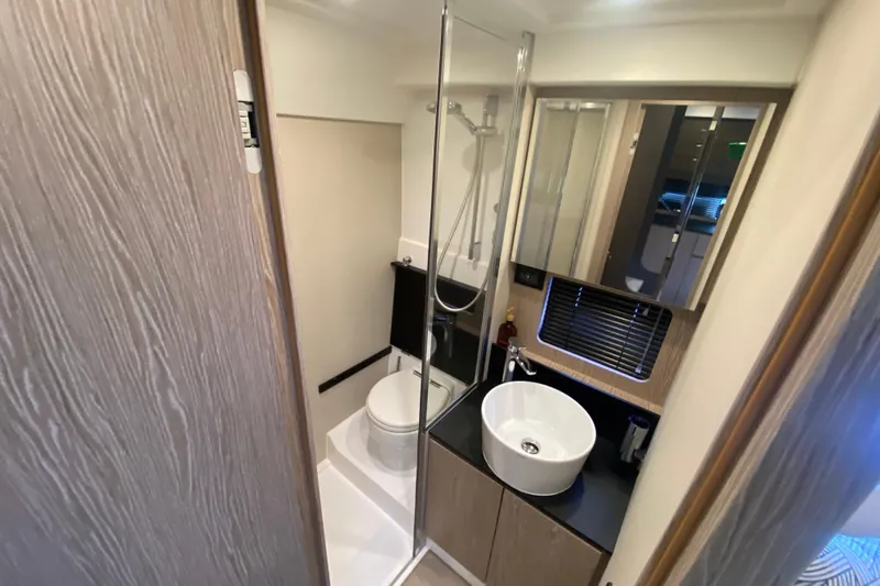  Yacht Photos Pics Modern bathroom in 2021 Azimut Atlantis 45 yacht with sleek fixtures and shower.