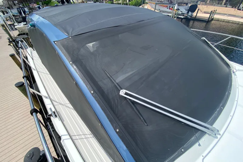  Yacht Photos Pics 2021 Azimut Atlantis 45 yacht with covered windshield docked at marina.