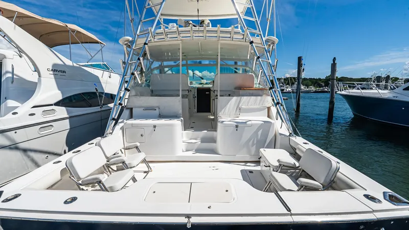  Yacht Photos Pics 2008 Cabo 38 Express yacht docked at marina, featuring spacious deck and seating.