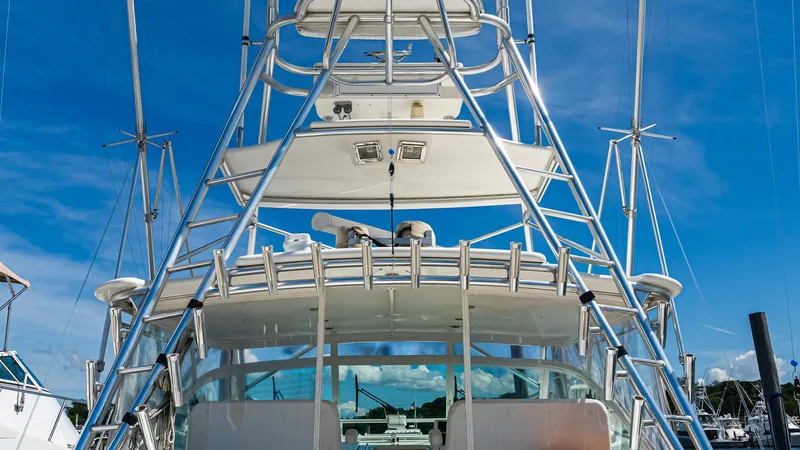  Yacht Photos Pics 2008 Cabo 38 Express yacht with tower against clear blue sky.