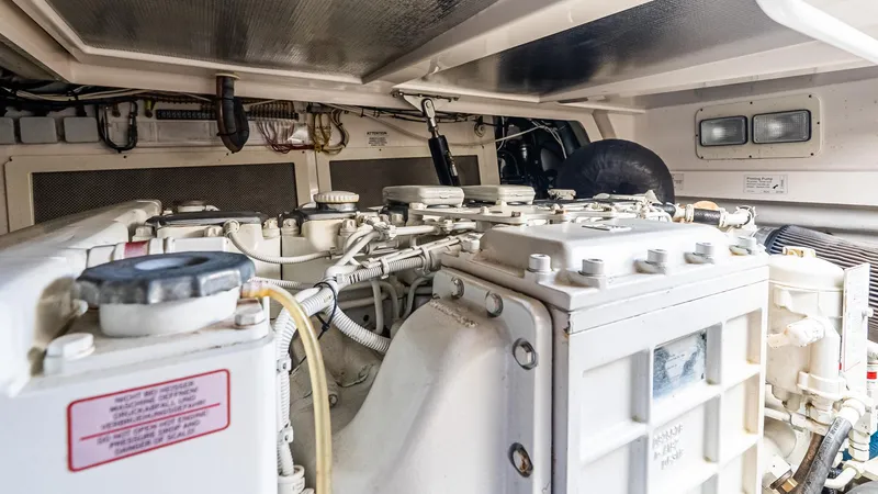  Yacht Photos Pics Engine room of 2008 Cabo 38 Express boat, showcasing mechanical components and wiring.