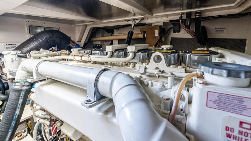  Yacht Photos Pics Engine room of a 2008 Cabo 38 Express boat, showcasing detailed machinery and components.