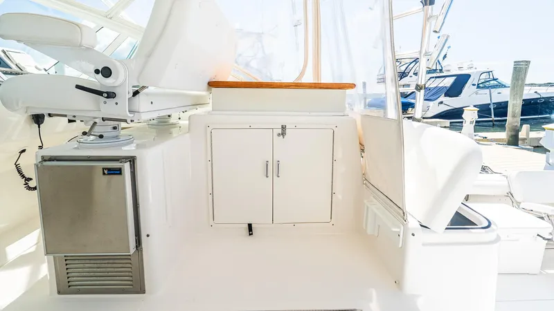  Yacht Photos Pics 2008 Cabo 38 Express boat interior with white seating and storage compartments.