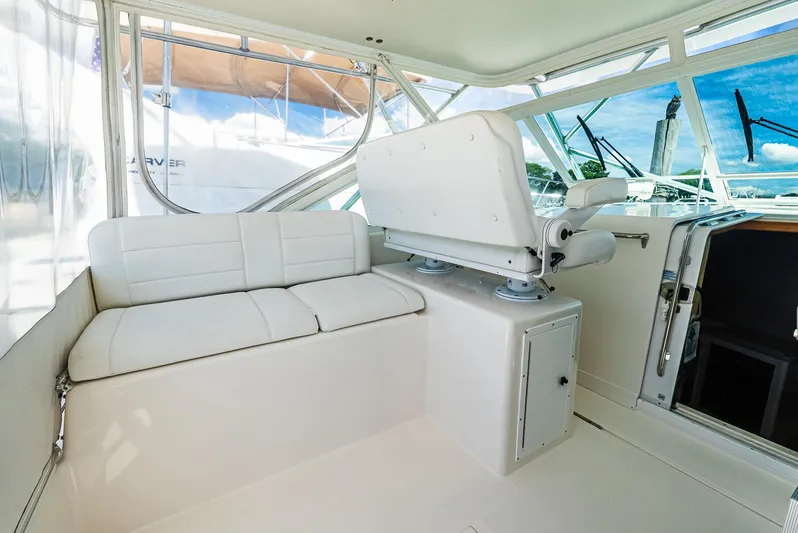  Yacht Photos Pics 2008 Cabo 38 Express boat interior with white seating and helm station.