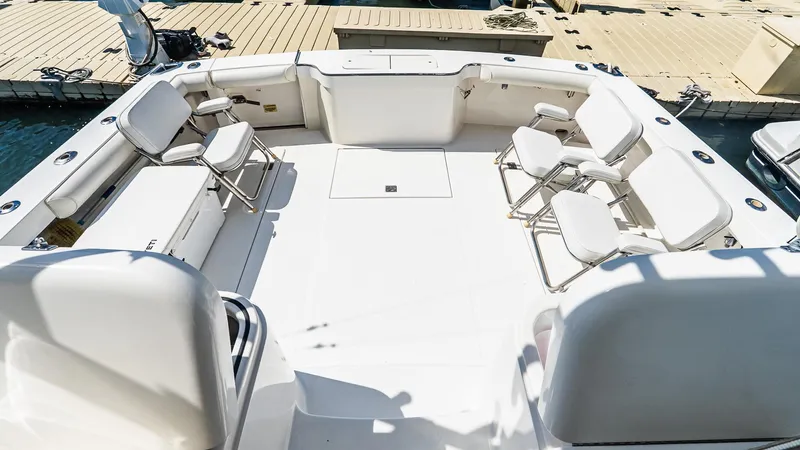  Yacht Photos Pics Spacious deck of 2008 Cabo 38 Express boat with seating and dock view.