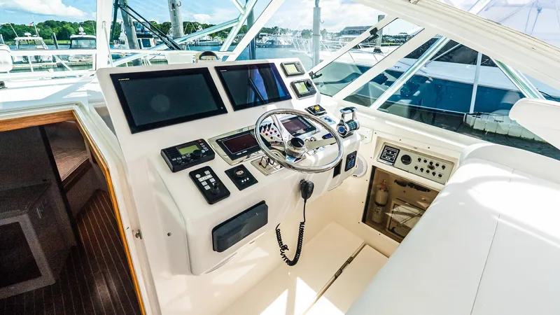  Yacht Photos Pics Helm of 2008 Cabo 38 Express yacht with modern navigation equipment and controls.