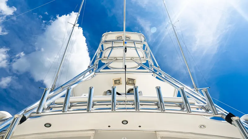  Yacht Photos Pics 2008 Cabo 38 Express yacht, viewed from below against a bright blue sky.
