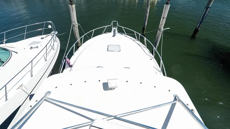  Yacht Photos Pics 2008 Cabo 38 Express yacht docked, viewed from above, surrounded by calm water.