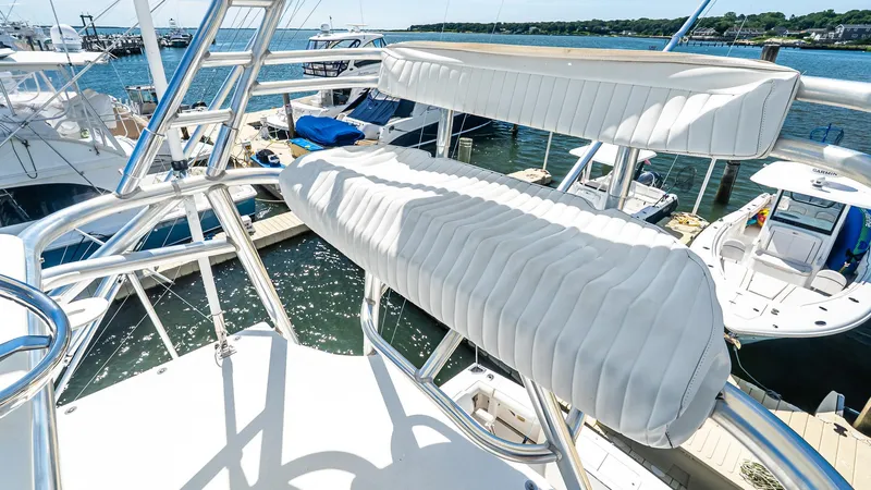 Yacht Photos Pics 2008 Cabo 38 Express boat with white seating and marina view.