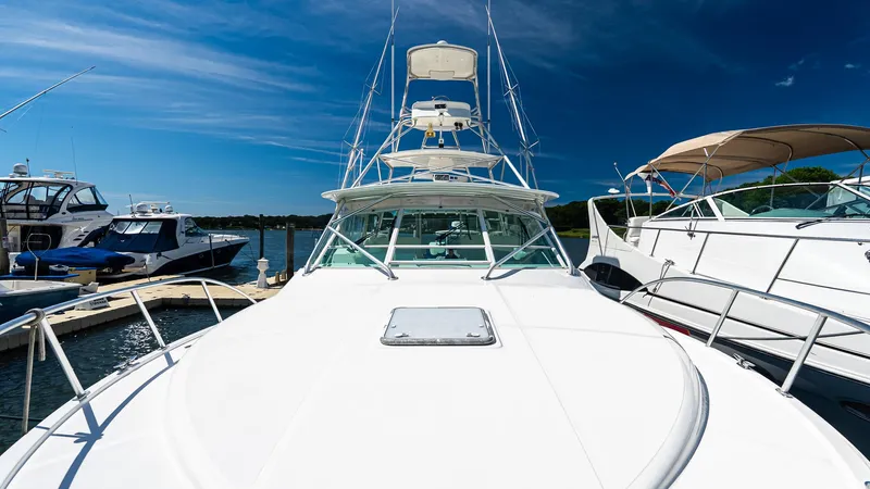  Yacht Photos Pics 2008 Cabo 38 Express yacht docked under clear blue sky.