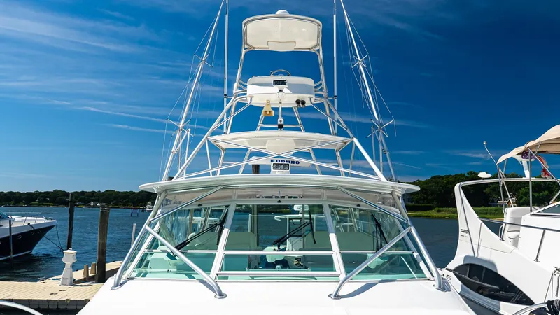  Yacht Photos Pics 2008 Cabo 38 Express boat docked under clear blue sky.