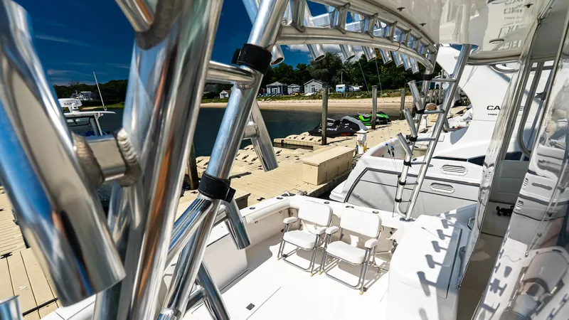  Yacht Photos Pics 2008 Cabo 38 Express yacht docked, featuring sleek design and polished metalwork.