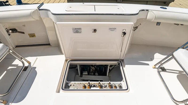  Yacht Photos Pics 2008 Cabo 38 Express boat deck with open hatch and seating.