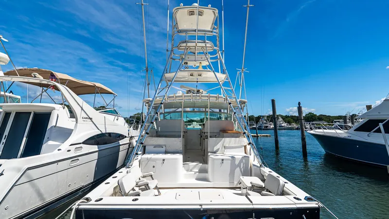  Yacht Photos Pics 2008 Cabo 38 Express boat docked at marina under clear blue sky.