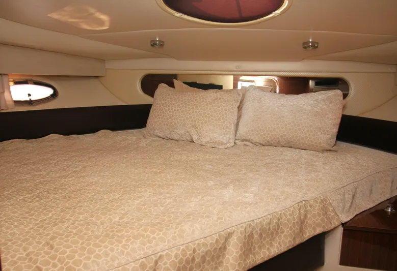 Sapphire Yacht Photos Pics Luxurious cabin interior of 2014 Regal 38 Express yacht with cozy bedding.