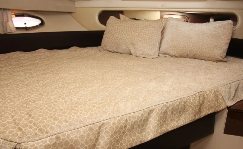 Sapphire Yacht Photos Pics Luxurious cabin interior of 2014 Regal 38 Express yacht with cozy bedding.