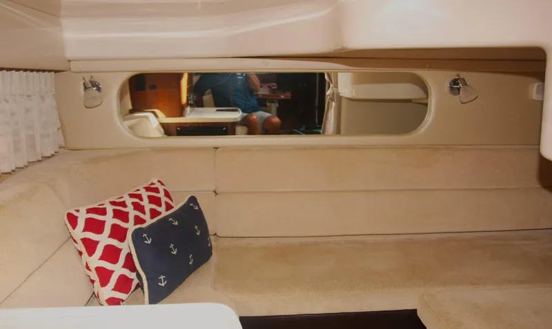 Sapphire Yacht Photos Pics Interior of 2014 Regal 38 Express yacht with beige seating and nautical-themed pillows.