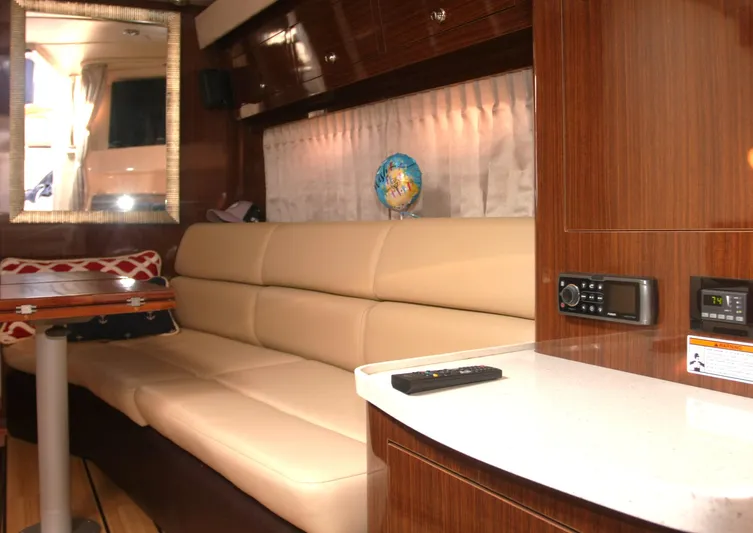 Sapphire Yacht Photos Pics Interior of 2014 Regal 38 Express yacht with beige seating and wooden accents.