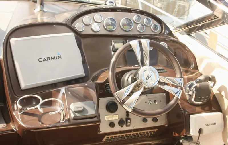 Sapphire Yacht Photos Pics 2014 Regal 38 Express helm with Garmin navigation system and stylish steering wheel.