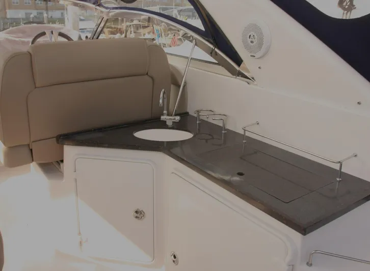 Sapphire Yacht Photos Pics 2014 Regal 38 Express yacht interior with kitchenette and seating area.