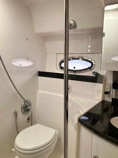 Sapphire Yacht Photos Pics Luxurious bathroom in 2014 Regal 38 Express yacht with modern fixtures and sleek design.