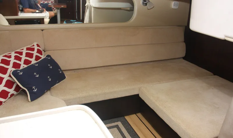 Sapphire Yacht Photos Pics Interior of 2014 Regal 38 Express yacht with beige seating and nautical-themed pillows.