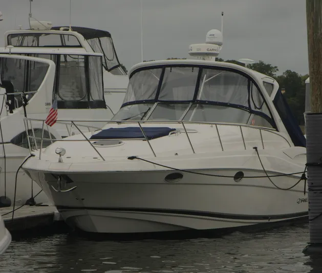 Sapphire Yacht Photos Pics 2014 Regal 38 Express yacht docked at marina, overcast sky.