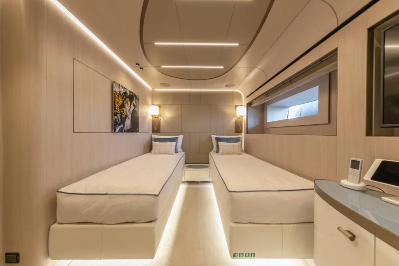 Eiv Yacht Photos Pics Luxurious twin cabin interior on 2020 Rossinavi Custom yacht, featuring modern design and ambient lighting.