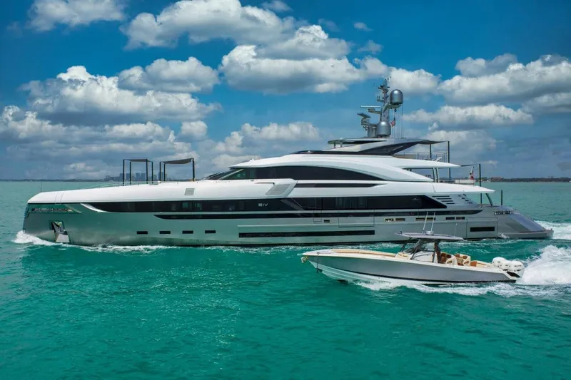 Eiv Yacht Photos Pics Luxurious 2020 Rossinavi Custom yacht cruising alongside a speedboat in turquoise waters.