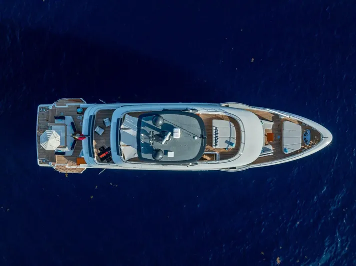 King's Lair Yacht Photos Pics Aerial view of 2023 Benetti 34M OASIS yacht on deep blue ocean.