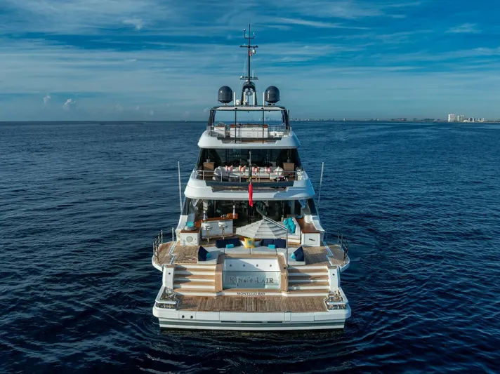 King's Lair Yacht Photos Pics Luxurious 2023 Benetti 34M OASIS yacht on open sea, rear view.