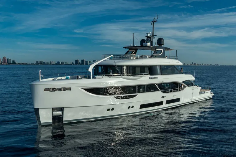 King's Lair Yacht Photos Pics Luxurious 2023 Benetti 34M OASIS yacht cruising on open water.