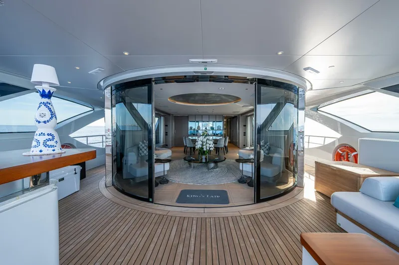 King's Lair Yacht Photos Pics Luxurious interior of 2023 Benetti 34M OASIS yacht with elegant decor and ocean view.