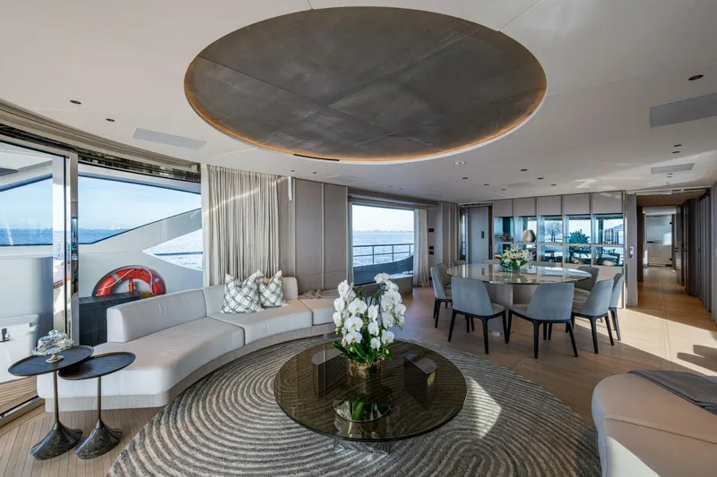 King's Lair Yacht Photos Pics Luxurious interior of 2023 Benetti 34M OASIS yacht with elegant seating and ocean view.