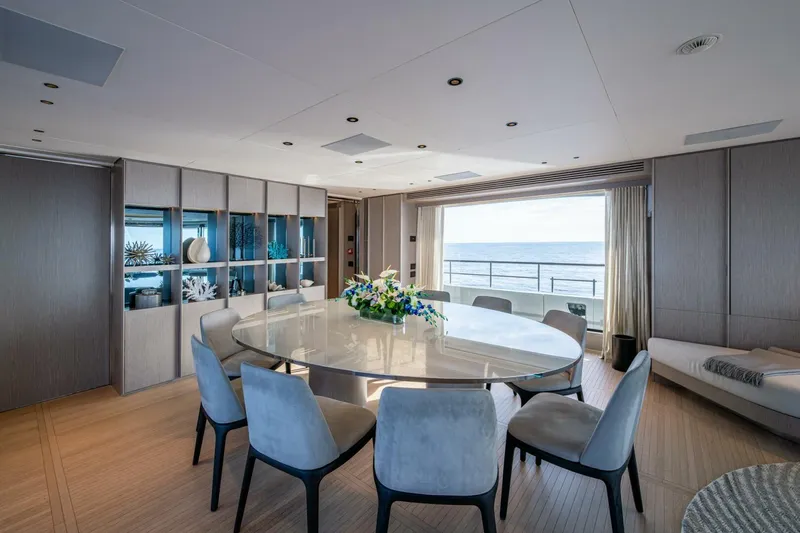 King's Lair Yacht Photos Pics Luxurious dining area on 2023 Benetti 34M OASIS yacht with ocean view.