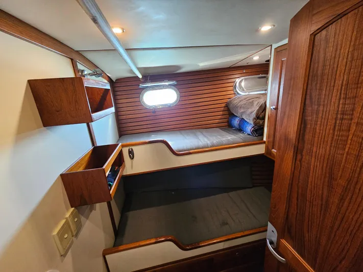 Good Job Yacht Photos Pics 2002 Nordhavn Trawler cabin with wooden interior and bunk beds.