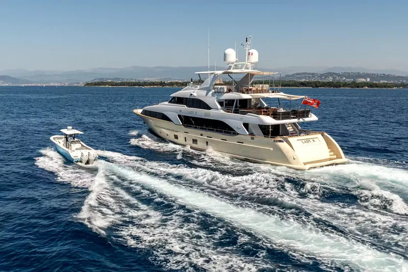 Lady H Yacht Photos Pics Luxury Benetti Majesty 120 yacht cruising with a smaller boat, 2011 model.