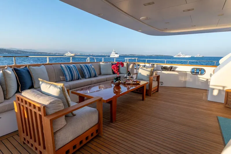 Lady H Yacht Photos Pics Luxurious deck of 2011 Benetti Majesty 120 yacht with elegant seating and ocean view.