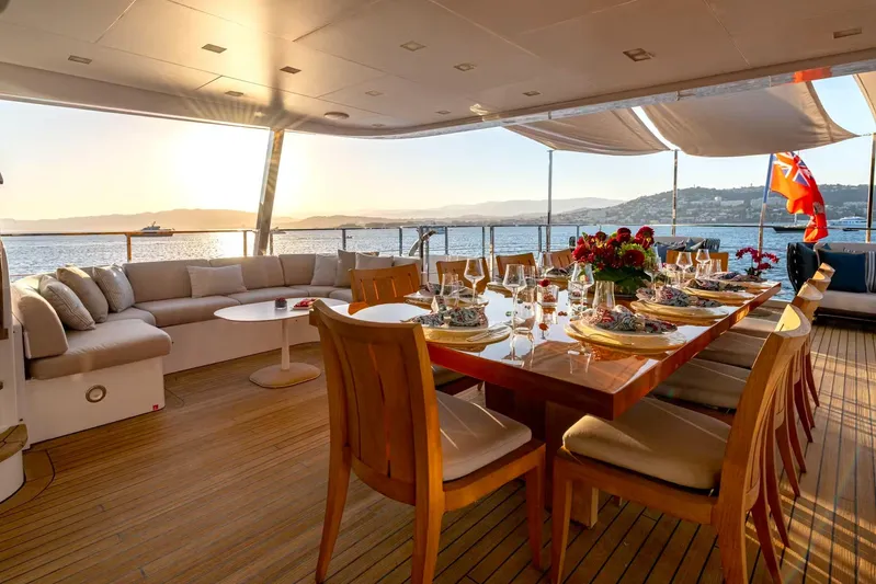 Lady H Yacht Photos Pics Luxurious Benetti Majesty 120 yacht deck with elegant dining setup, sunset view, 2011 model.