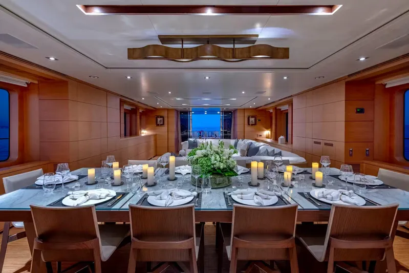 Lady H Yacht Photos Pics Luxurious dining area on 2011 Benetti Majesty 120 yacht, elegantly set with candles and flowers.