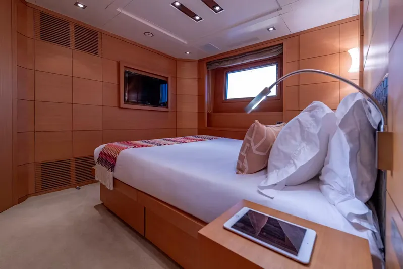 Lady H Yacht Photos Pics Luxurious bedroom interior on 2011 Benetti Majesty 120 yacht, featuring modern design and amenities.