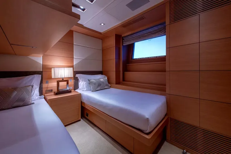 Lady H Yacht Photos Pics Luxurious cabin interior of 2011 Benetti Majesty 120 yacht with twin beds and elegant wood paneling.