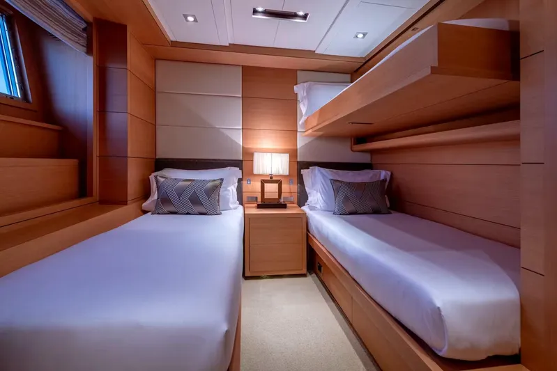 Lady H Yacht Photos Pics Luxurious twin cabin on 2011 Benetti Majesty 120 yacht, featuring modern wood paneling.