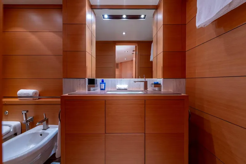 Lady H Yacht Photos Pics Luxurious bathroom interior on 2011 Benetti Majesty 120 yacht, featuring sleek wood paneling.