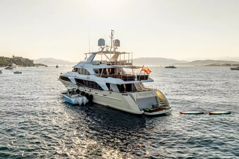 Lady H Yacht Photos Pics Luxurious 2011 Benetti Majesty 120 yacht anchored in scenic coastal waters.