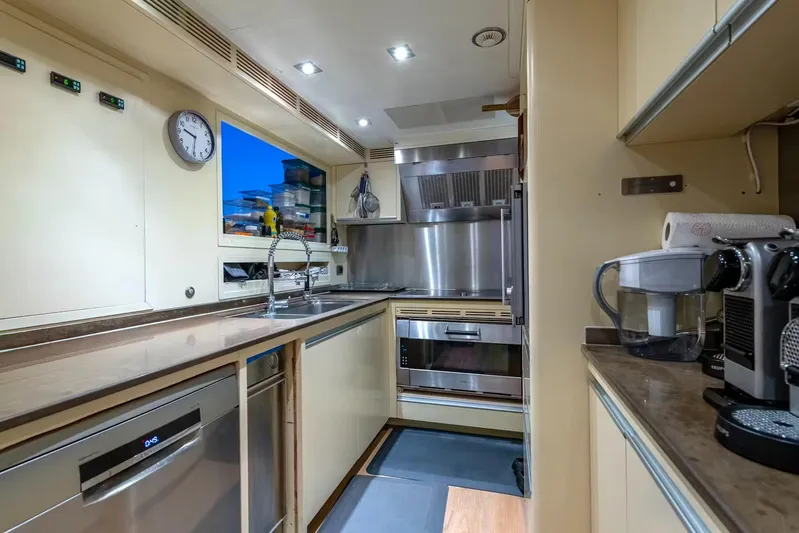 Lady H Yacht Photos Pics Modern kitchen interior on 2011 Benetti Majesty 120 yacht, featuring stainless steel appliances and sleek design.