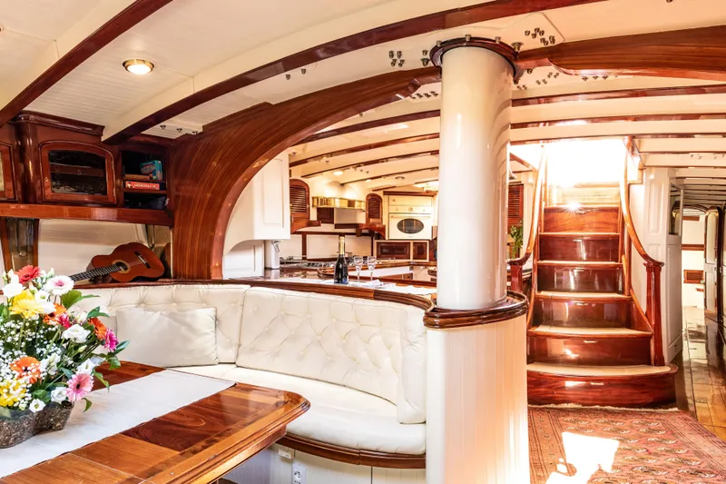Whitefin Yacht Photos Pics Luxurious interior of 1983 Renaissance Yachts New Classic Sloop with elegant wood finishes.