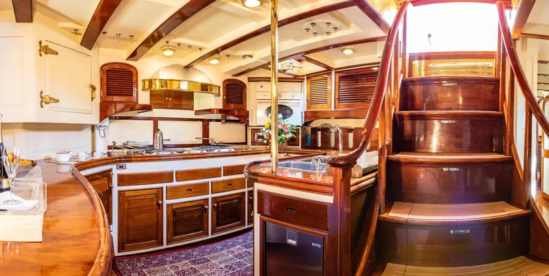 Whitefin Yacht Photos Pics Luxurious 1983 Renaissance Yachts sloop interior with elegant wood finishes and classic nautical design.